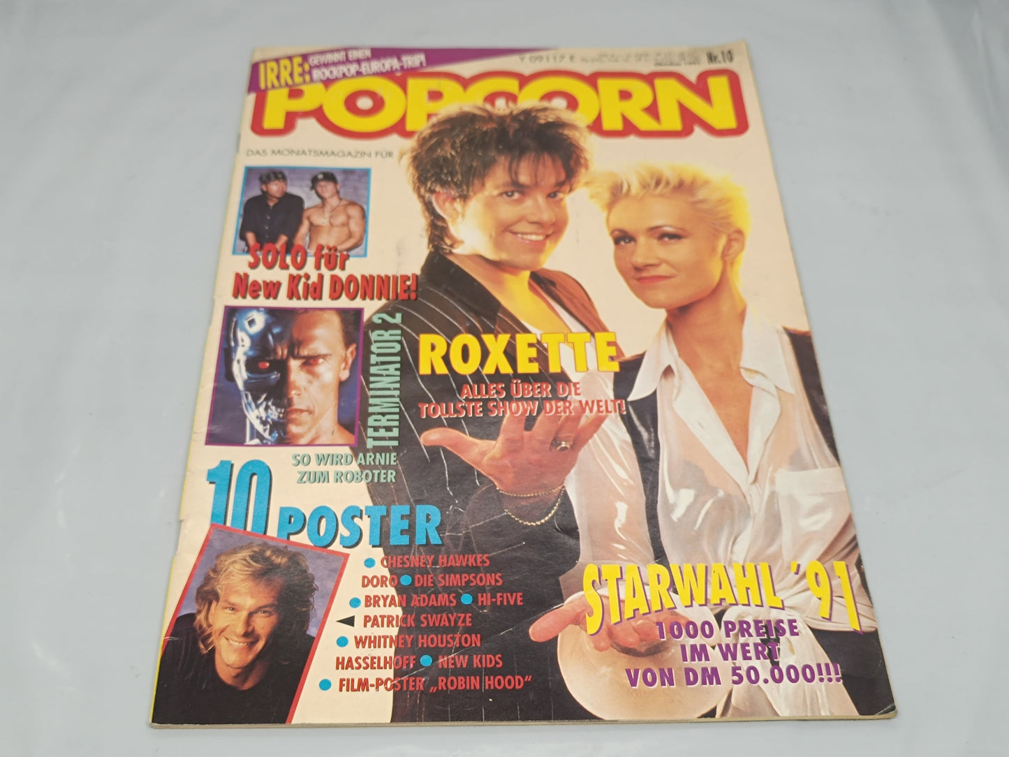 Vintage magazine cover with two people on a white background