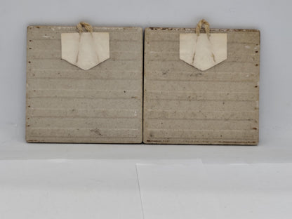 Two ceramic wall tiles with sayings for every home.